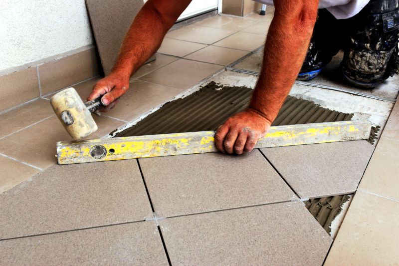 Skilled Tile Installer at Work